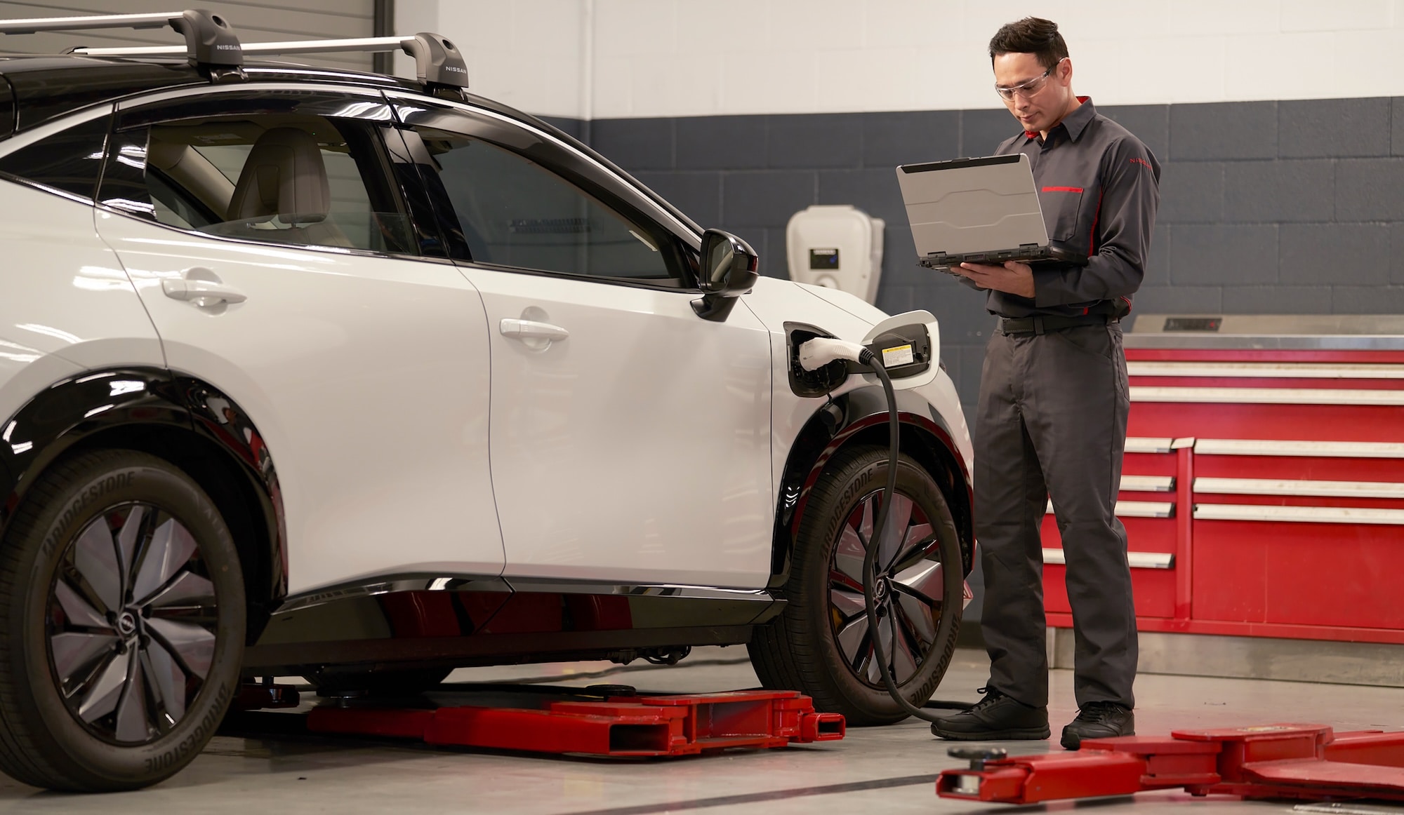  Person cheerfully signing documents.