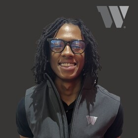 Staff member Christian Taylor from ID_a06ef7f9e128