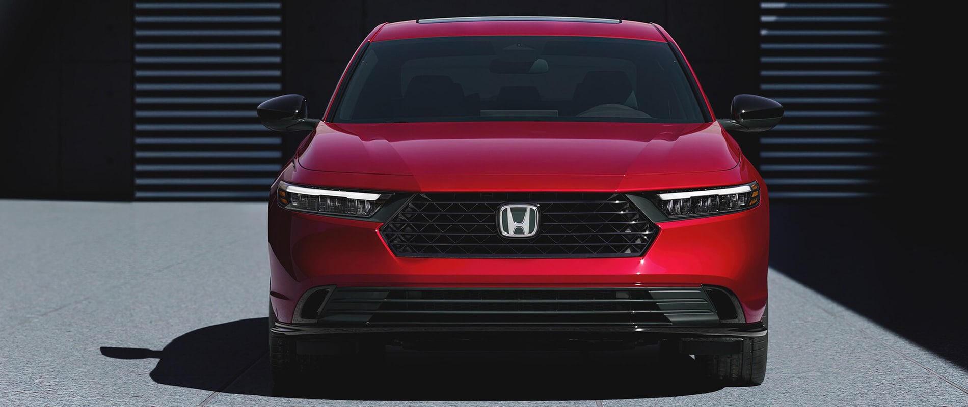 Sedans for Sale Near Orlando, FL A front view of a red Honda Accord.