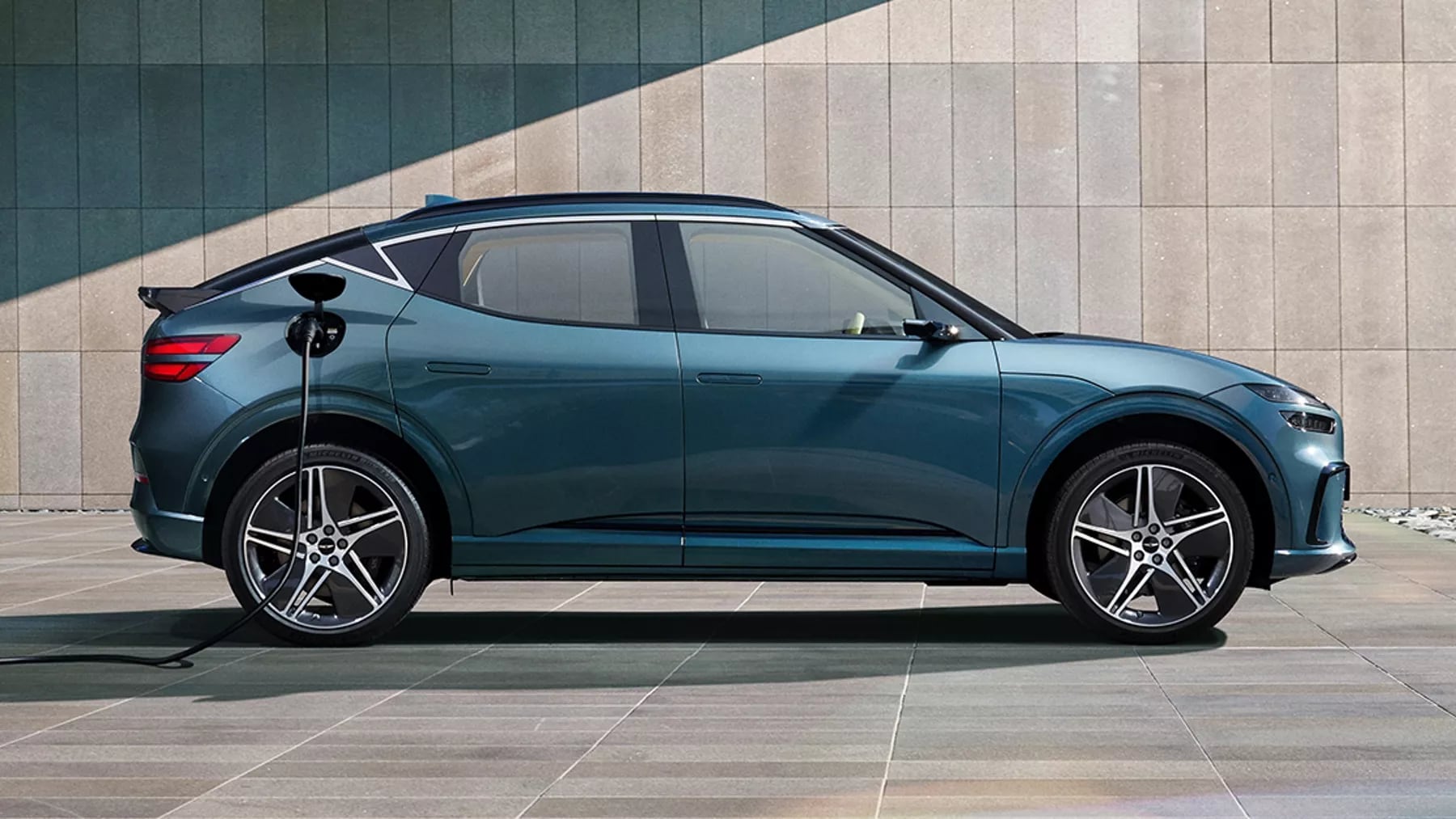 Tromso Green 2026 Genesis GV60 plugged-in charging