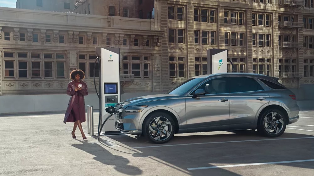 genesis-ev-electric-charging-woman.png