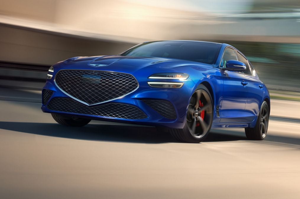 Blue 2026 Genesis G70 going very fast