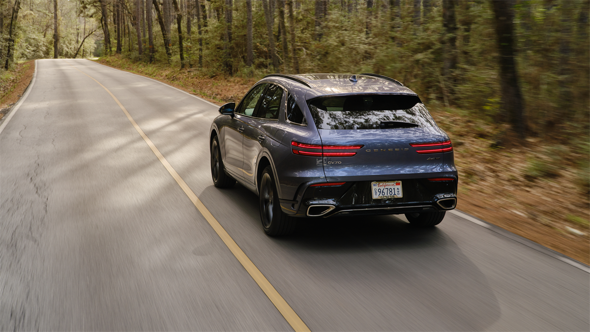 2026 Genesis GV70 driving down the highway
