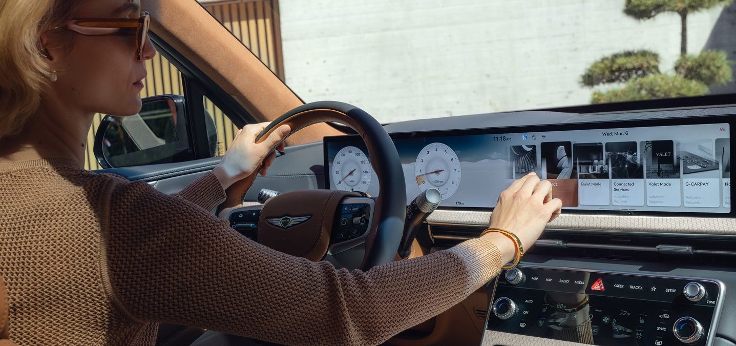 2025 Genesis GV70 - woman using touchscreen