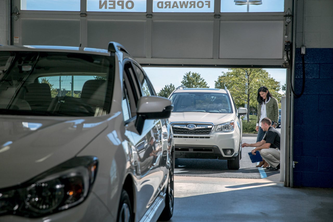 A Subaru vehicle being inspected at a service facility