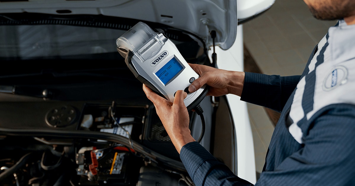Volvo technician checking a car battery