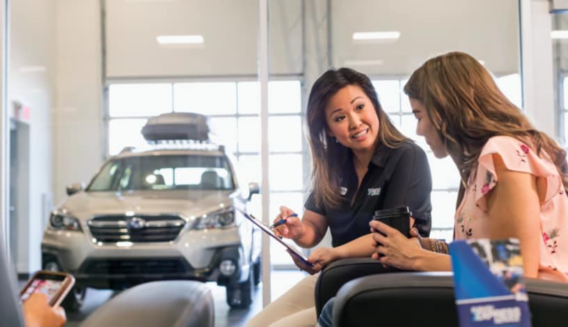 Jensen Subaru sales consultation in Sioux City, IA dealership showroom