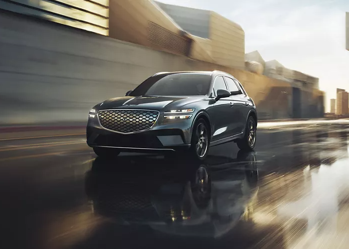  2025 Genesis Electrified GV70 turning on a street