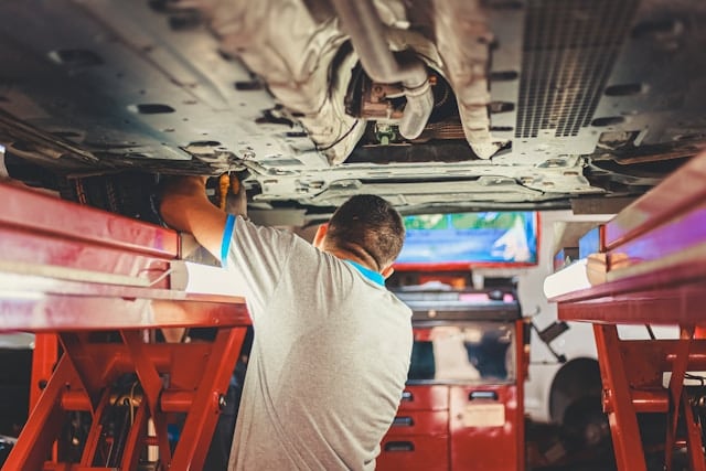 mechanic working under a car