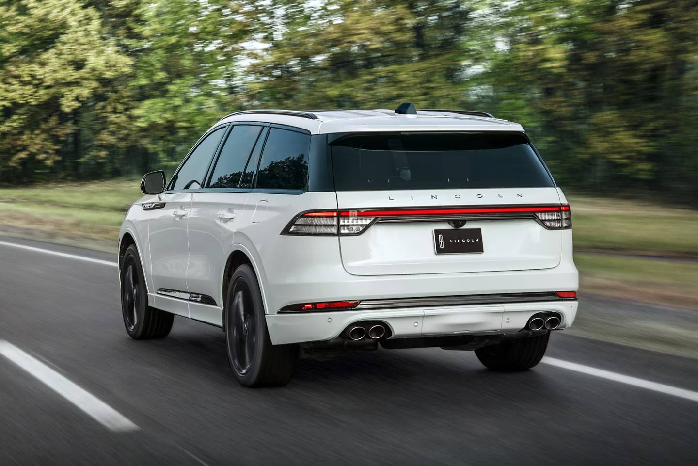 white 2025 lincoln aviator on a scenic drive