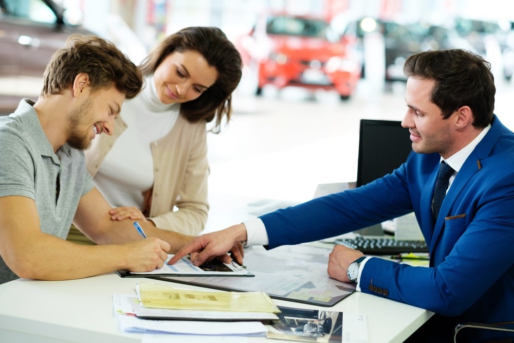 Couple Signing Subaru Lease