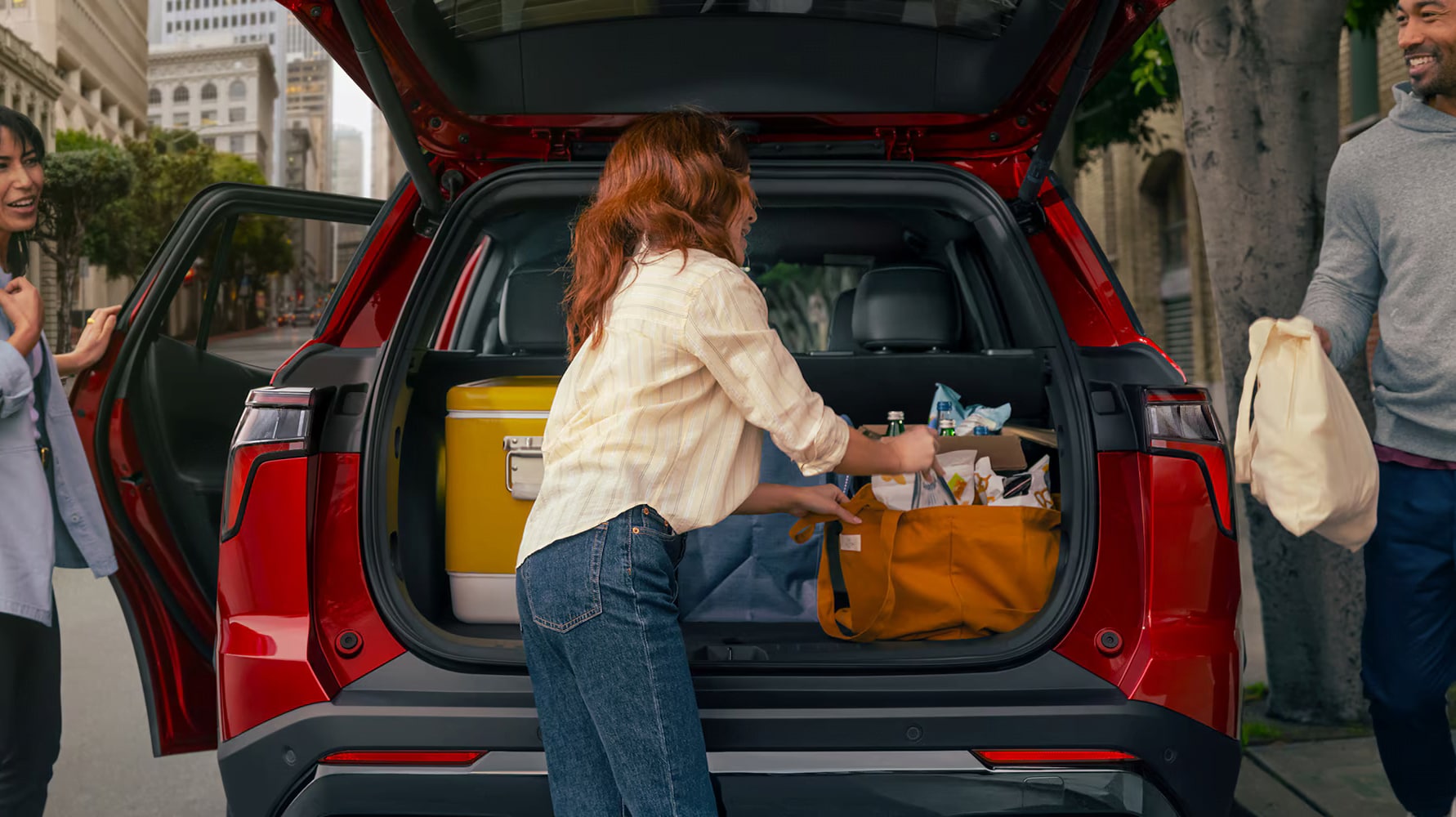 Family loading the 2026 Chevrolet Equinox with cargo