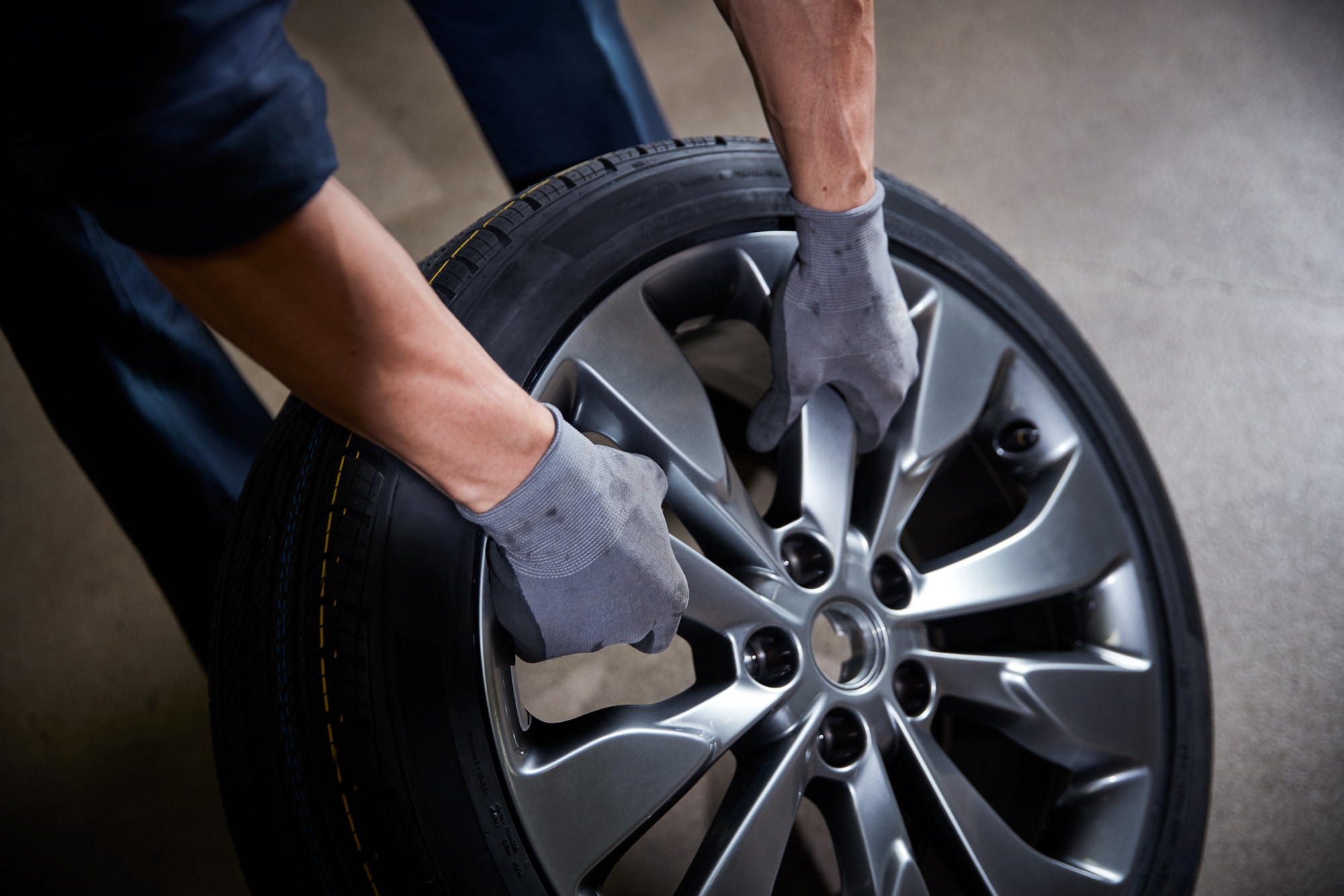 Service technician picking out new Chevy tires