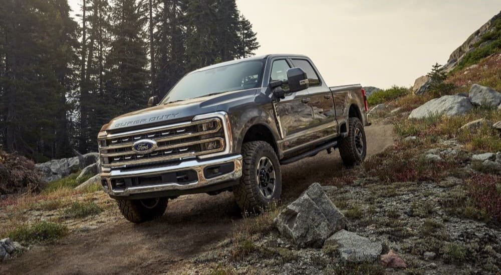 Ford Dealer in Atlanta GA - 2023 Ford F-250 Tremor - Descend.jpg A dark grey 2023 Ford F-250 Tremor is shown descending a trail after leaving a Ford dealer in Atlanta, GA.