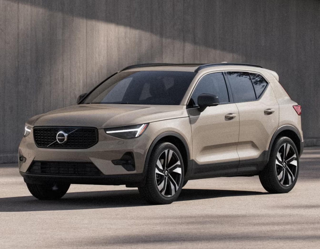 2026 Volvo XC40 SUV is parked on a smooth concrete surface, angled slightly to the left.