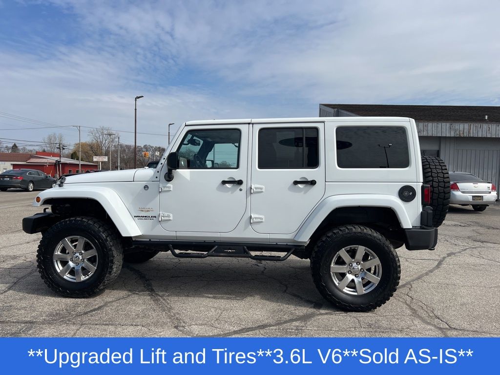 Used 2013 Jeep Wrangler Unlimited Sahara with VIN 1C4BJWEG3DL628718 for sale in Alma, MI
