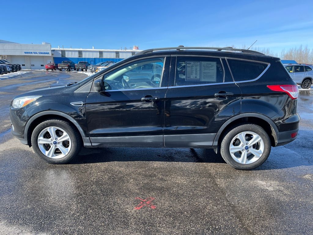 Used 2016 Ford Escape SE with VIN 1FMCU9G95GUC84539 for sale in Charlevoix, MI