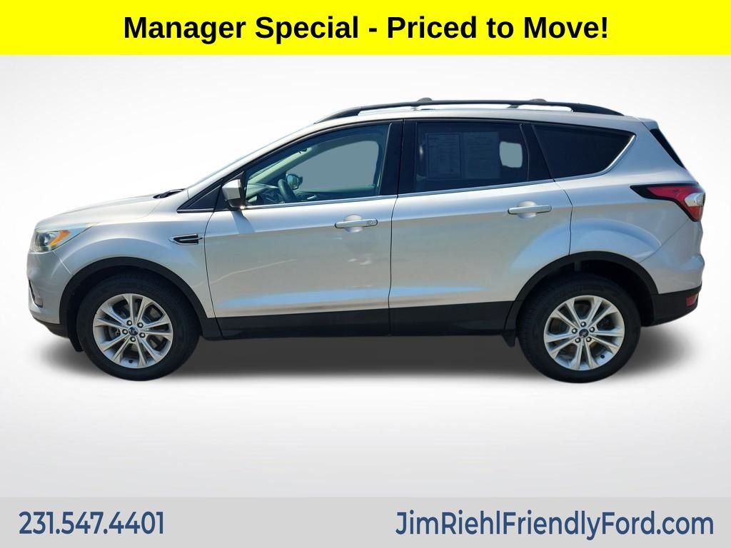Used 2017 Ford Escape SE with VIN 1FMCU9GD8HUC91975 for sale in Charlevoix, MI