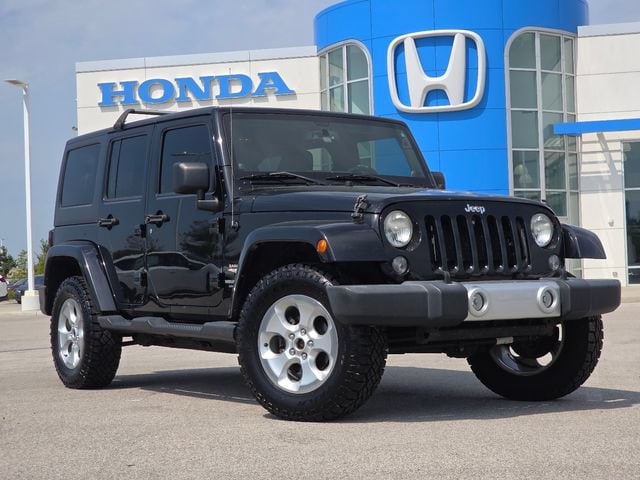 Used 2014 Jeep Wrangler Unlimited Sahara with VIN 1C4BJWEG4EL117195 for sale in Maumee, OH