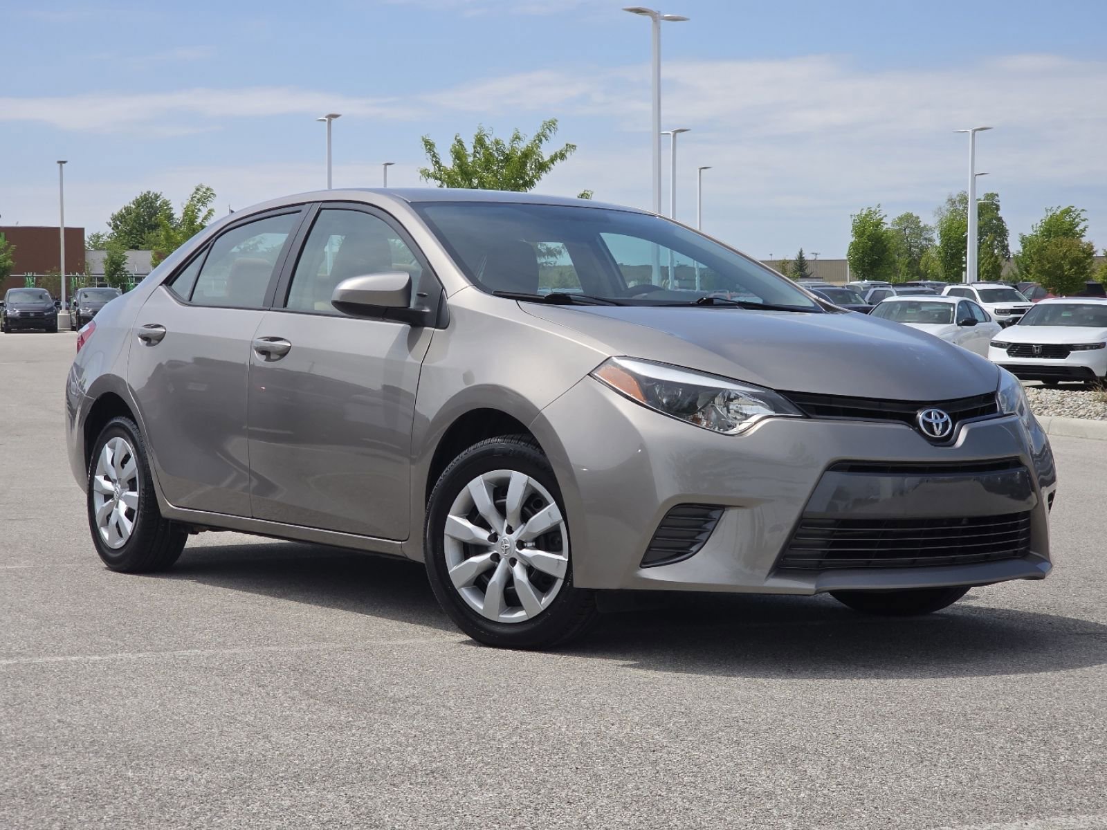 Used 2016 Toyota Corolla LE with VIN 2T1BURHE0GC588242 for sale in Maumee, OH