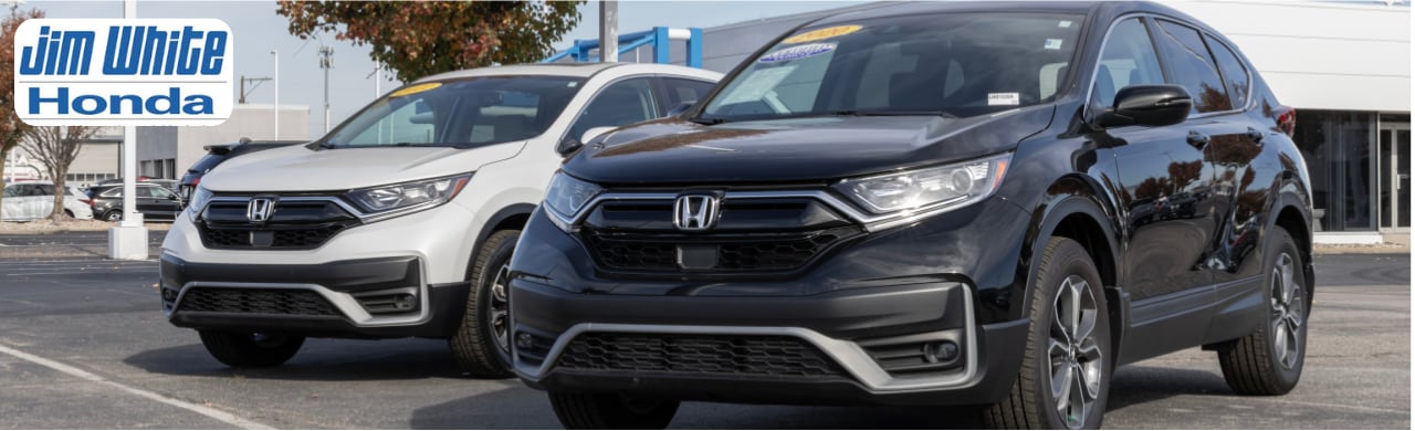 Pre-owned vehicles lined up at Jim White Honda dealership near Toledo