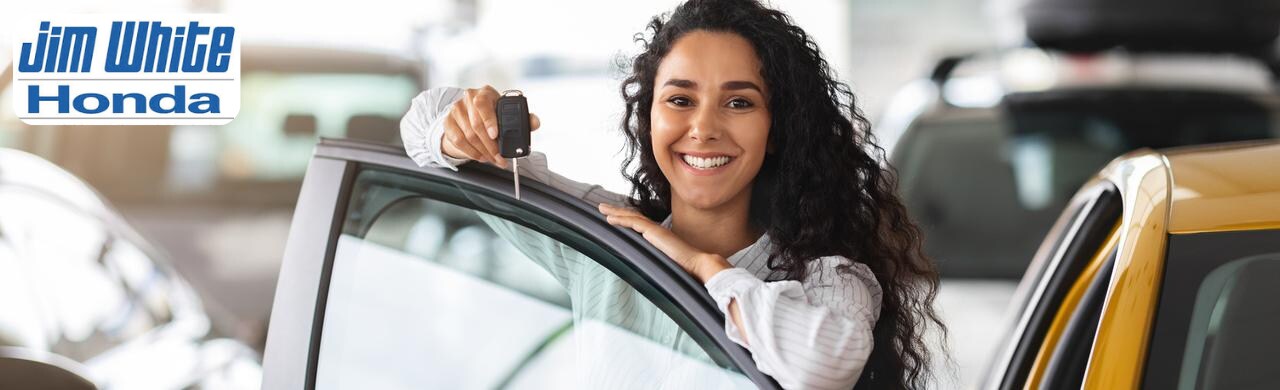 Row of new Honda vehicles available for lease at Jim White Honda in Maumee, OH