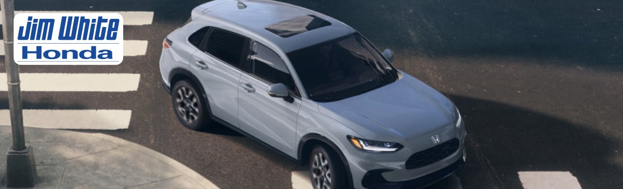 2025 Honda HR-V parked near downtown Toledo, showcasing its compact SUV design and LED headlights