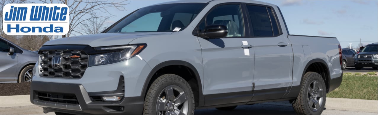 Selection of used pickup trucks at Jim White Honda dealership near Toledo, Ohio