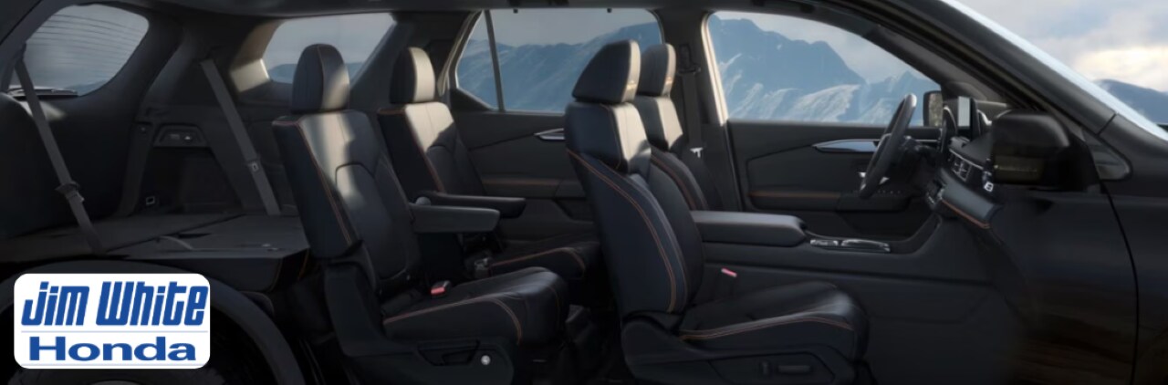 New Honda Pilot parked near a suburban Toledo home, showcasing its spacious exterior and family-friendly design.