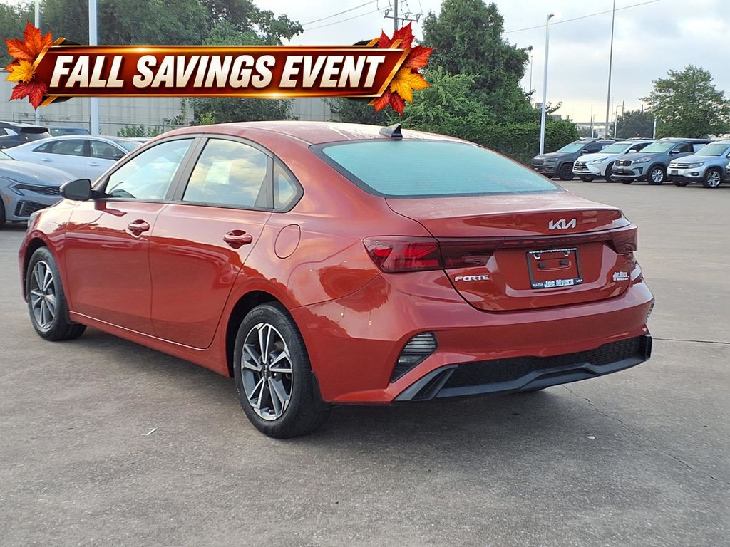 Certified Used 2023 Fire Orange Kia LXS image 2
