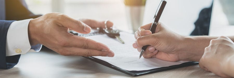 People signing finance papers