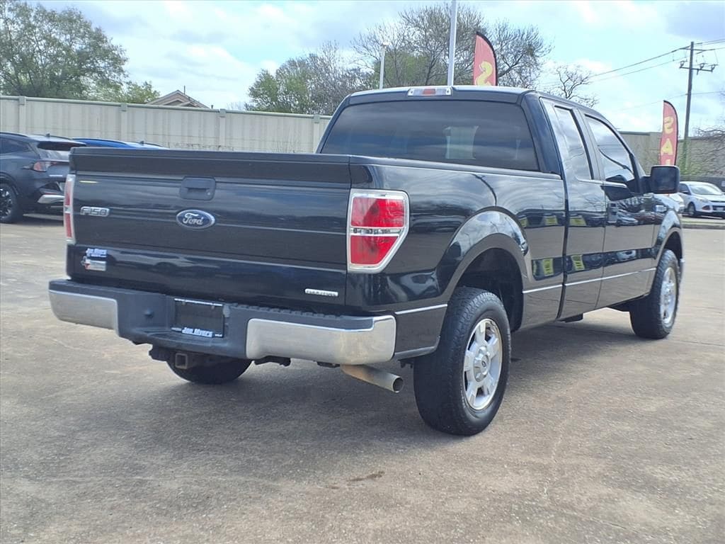 Used 2013 Tuxedo Black Metallic Ford XLT image 4