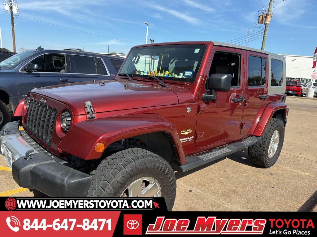 Used 2009 Red Rock Crystal Pearlcoat Jeep Unlimited Sahara image 4
