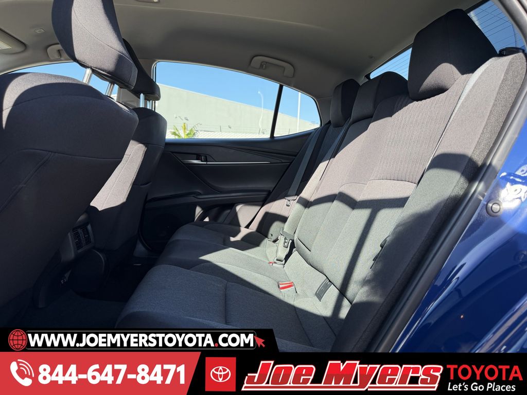 Used 2025 Reservoir Blue Toyota LE image 28