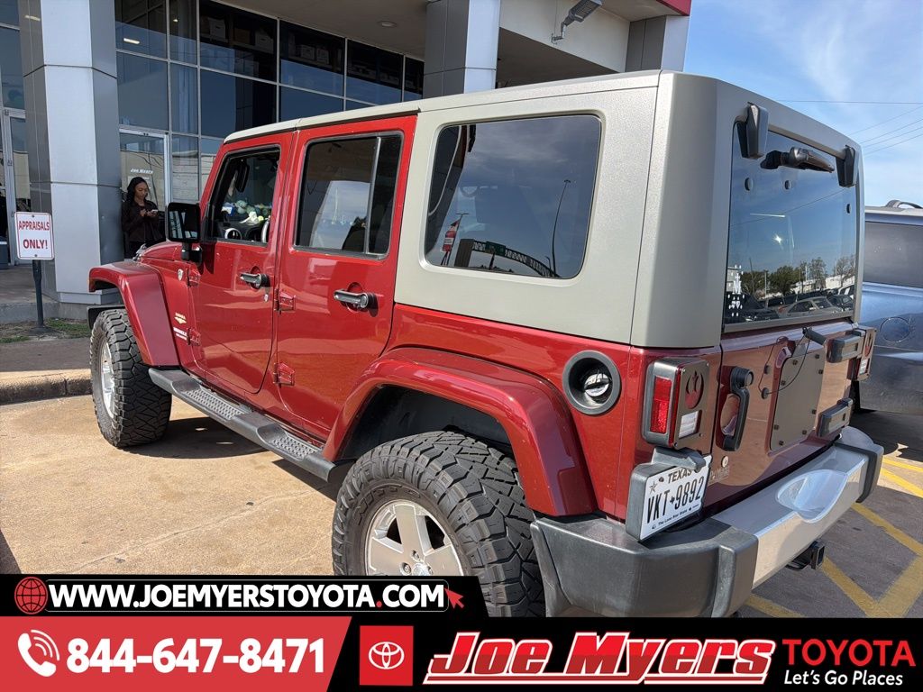 Used 2009 Red Rock Crystal Pearlcoat Jeep Unlimited Sahara image 2