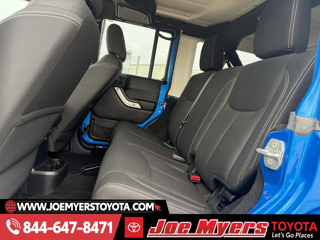 Used 2016 Hydro Blue Pearl Coat Jeep Unlimited Sahara image 26