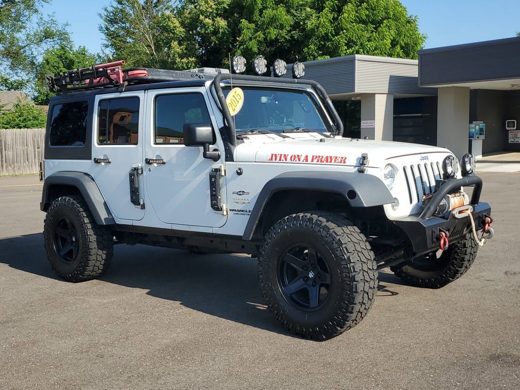 Used 2015 Jeep Wrangler Unlimited Sahara with VIN 1C4BJWEG9FL515844 for sale in Paw, MI