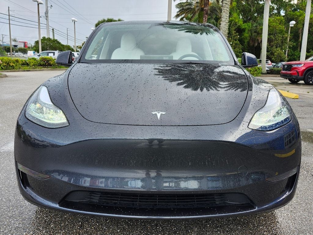Used 2025 Tesla Model Y Long Range with VIN 7SAYGDED3SF231483 for sale in Stuart, FL