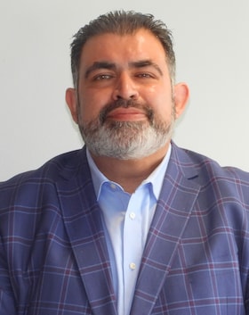 Staff member Ashkan Soroushi from 9733e143e1a8