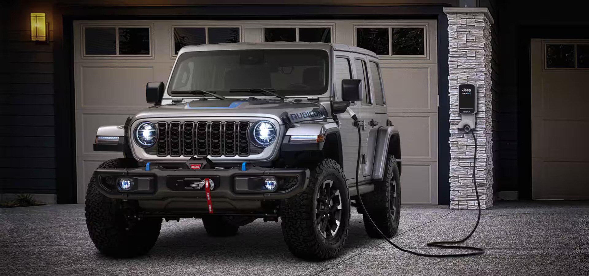 a jeep parked and plugged in to charge