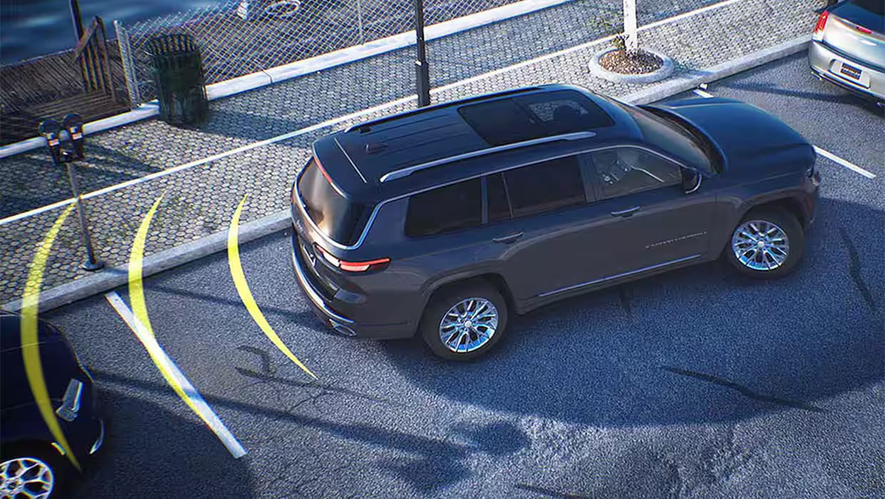 A suv backing into a parking sot.