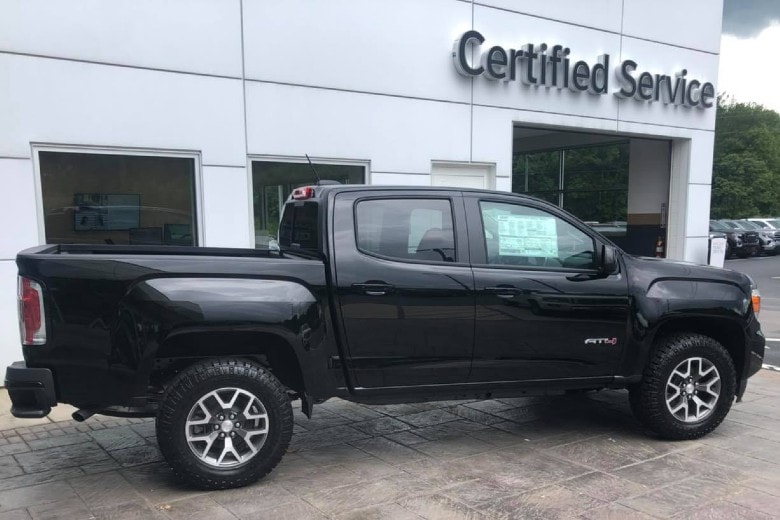 chevy Colorado infront of Certified Service Center