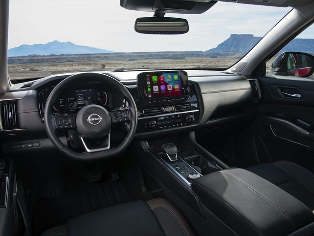 Interior driver's side view of a 2022 Nissan Pathfinder with black interior