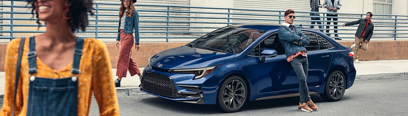 Blue Toyota Corolla LE parked downtown