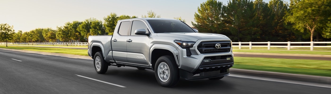 Silver Toyota Tacoma SR5 driving on a road