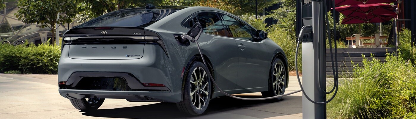 Grey Toyota Prius PHEV XSE Premium charging outside