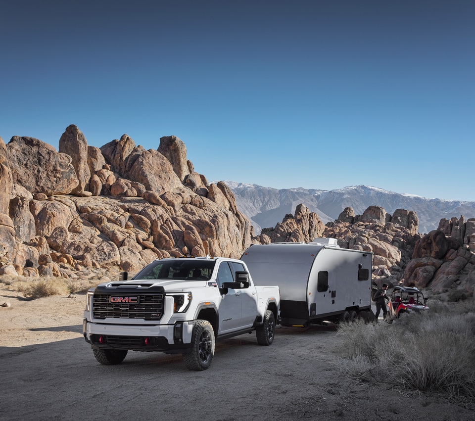 2025 GMC Sierra 1500 Denali towing a camper
