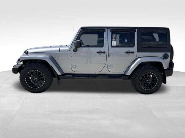Used 2015 Jeep Wrangler Unlimited Sahara with VIN 1C4BJWEG3FL743998 for sale in Webster City, IA