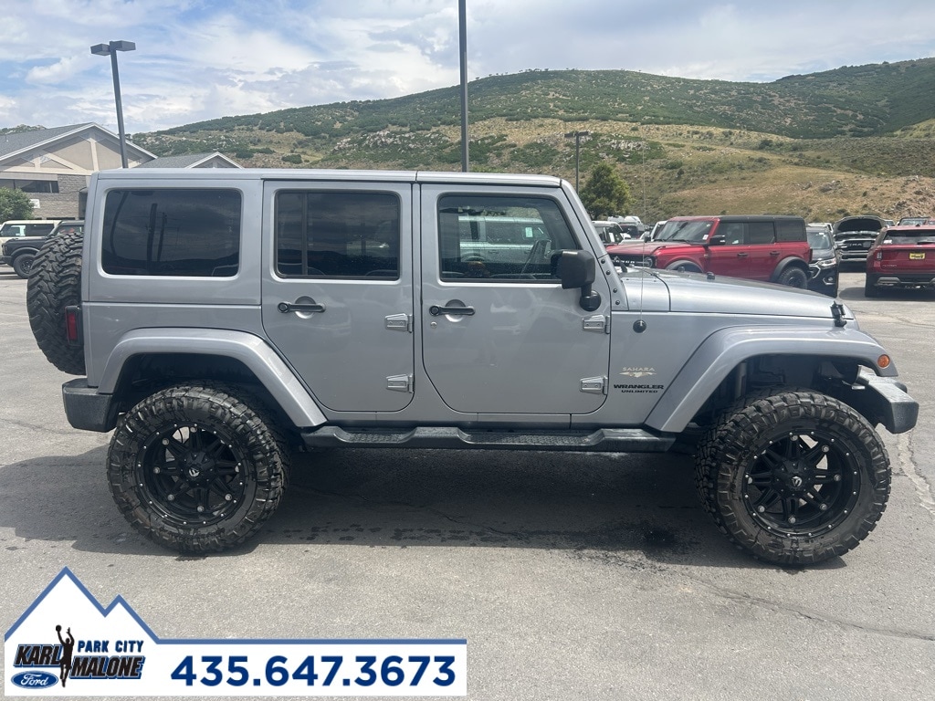 Used 2015 Jeep Wrangler Unlimited Sahara with VIN 1C4BJWEGXFL749667 for sale in Park City, UT