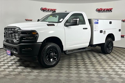 a white 2026 RAM 2500 with a utility box upfit parked at the Keene CDJR dealership in Jarrettsville, MD